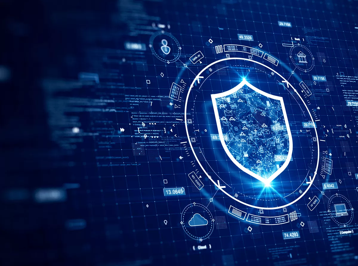 A cybersecurity professional monitoring university data protection on a digital screen, ensuring student privacy and online safety.